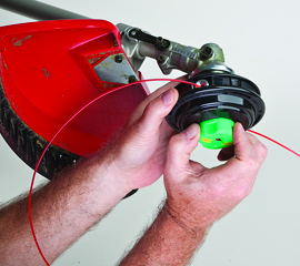 Hold drum securely and turn spool with direction of arrow to wind line into spool.